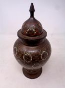 An Eastern brass lidded vase,