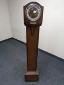 An Edwardian oak cased Bentima presentation granddaughter clock