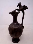 A 19th century bronze vase, with dragon handle,