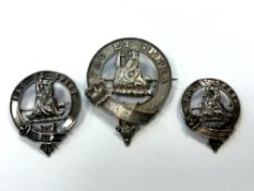 Three antique silver clan badges marked Fac et Spera ('Do and Hope')