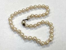A cultured pearl necklace set with a Sterling silver clasp