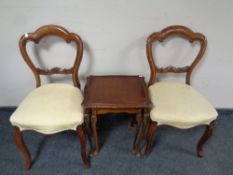A pair of Victorian dining chairs and nest of two tables