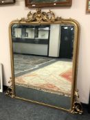 A 19th century mirror in ornate gilt frame,
