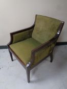 A twentieth century wooden frame armchair in green fabric