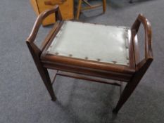 An Edwardian mahogany storage piano stool