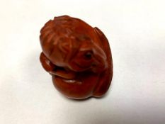 A Japanese carved fruitwood netsuke - Horse.