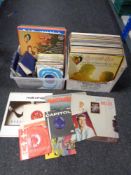 Two boxes of vinyl LP records, 7" singles and books to include The Hollies, opera,