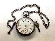 A silver open face key wound pocket watch on silver chain CONDITION REPORT: The