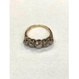 An 18ct gold and platinum set five stone graduated old cut diamond ring, approximately 1.