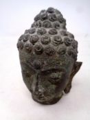 A bronze Buddha head,