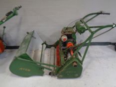 A vintage Atco petrol lawn mower with Villiers 1100 engine with built in roller and grass box