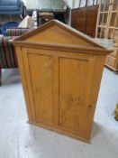 A 19th century pine wall mounted cupboard