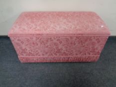 An Ottoman in pink floral fabric