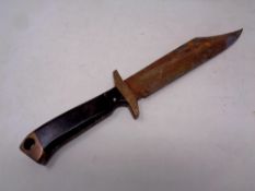 A Bowie knife (blade rusted)