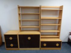 A mid 20th century pine triple section unit with bookshelves