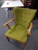 A mid 20th century teak framed armchair