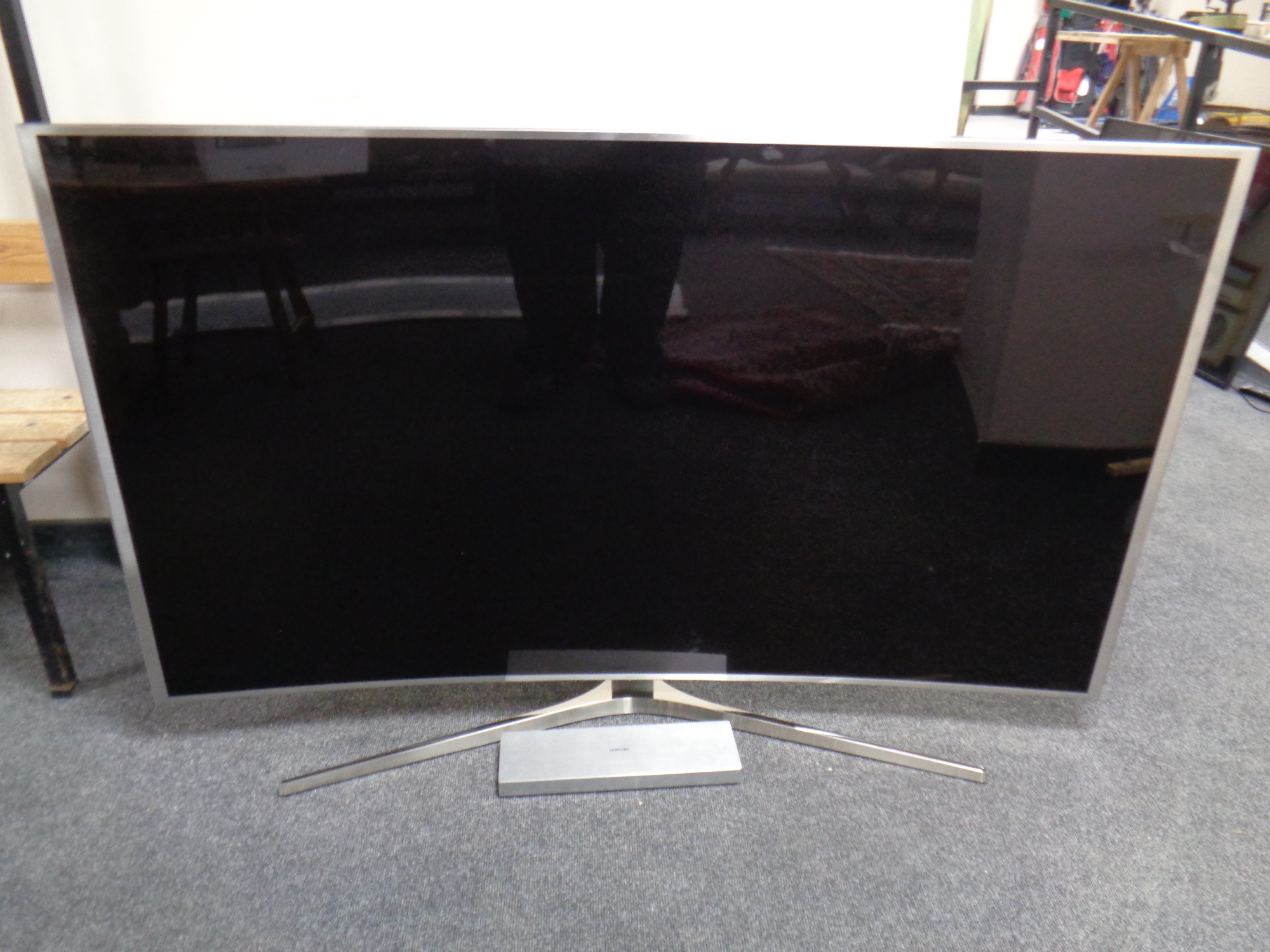 A Samsung SU HD 65'' curved TV with lead and remote CONDITION REPORT: Screen fault.