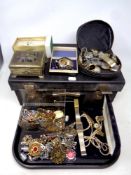 A tray of vintage leather case, quantity of costume jewellery, wristwatches, religious pendants,