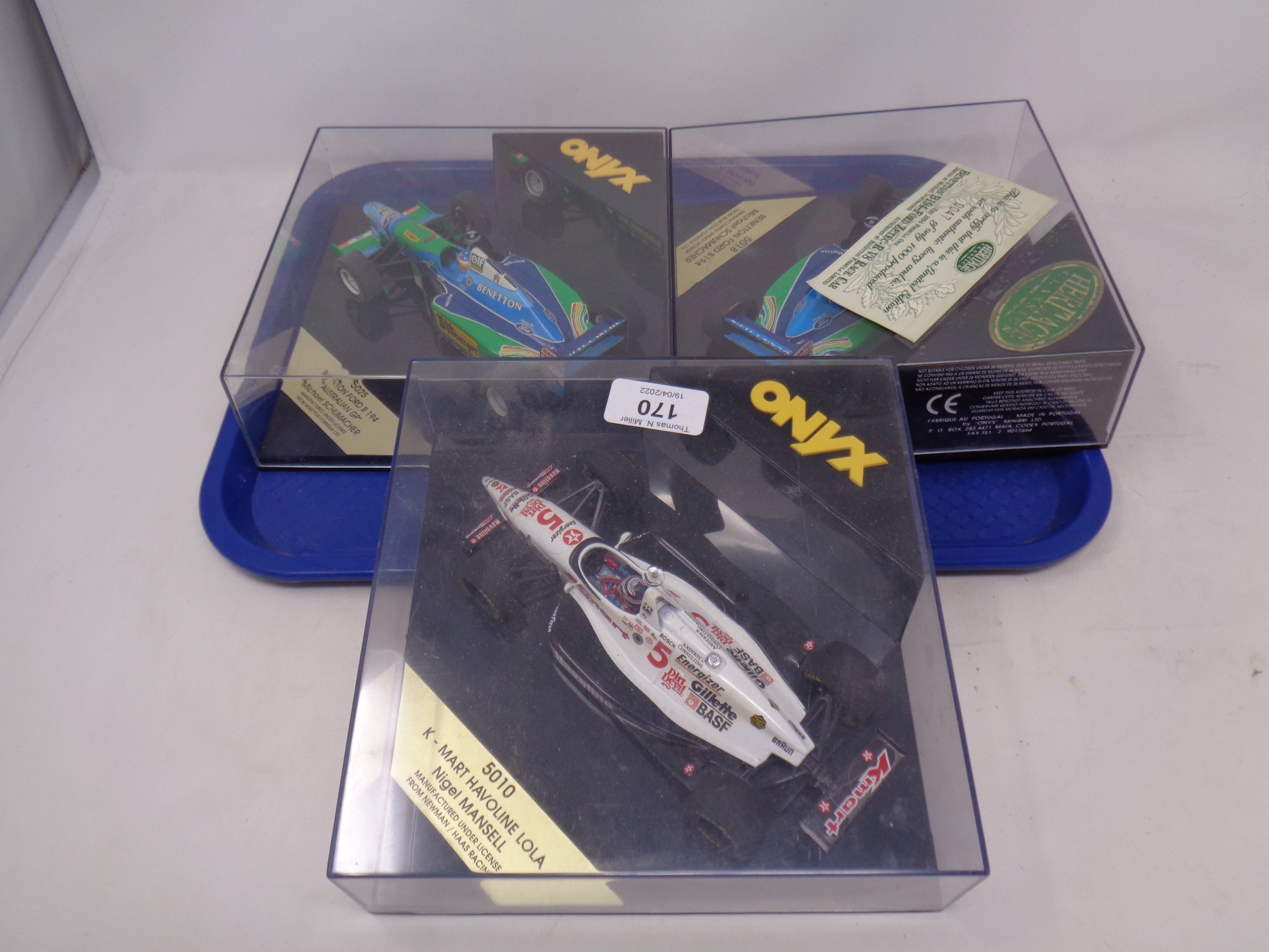Three Onyx Formula 1 models in plastic display cases to include Michael Schumacher,