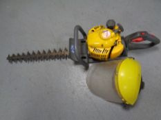 An Emak DH 27 dynamic petrol hedge trimmer with face guard