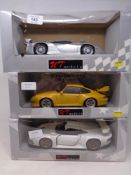 Three UT Models 1:18 die cast cars - Porsche 911 GT 1, Porsche 911 GT 2 and a Porsche GT I,