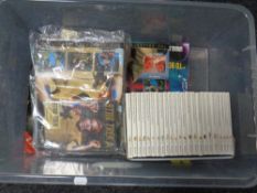 A box of Star Trek DVD's with magazines,