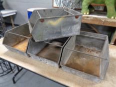 Four twentieth century galvanised tin trays