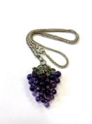 An antique silver emerald and amethyst grape bunch pendant on chain