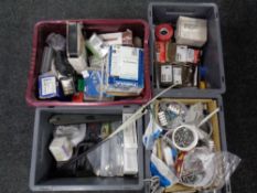 Four plastic crates of hardware, rawl plugs, screws, electrical components, saw blades,