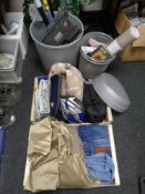 A plastic bin and two boxes of G-tech floor sweeper, curtains, jeans, bike accessories,