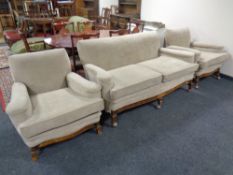 A late nineteenth century three piece lounge suite on carved walnut legs