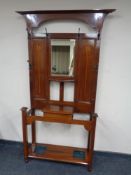 An inlaid mahogany Arts Nouveau mirrored hall stand