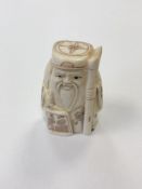 A small Japanese bone carving - Village Elder with Scroll.