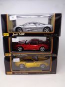 Three Maisto 1:18 Special Edition die cast vehicles - McLaren F1 and two Ferrari 550 Maranello,