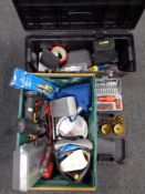 A plastic tool box and crate containing cased drill sets, ratchet and screw driver set,