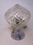 A twentieth century chrome table lamp with cut glass shade