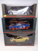 Three Paul's Model Art & UT Models 1:18 die cast cars - McLaren F1 road car in silver,