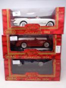 Three Mira 1:18 die cast vehicles - Corvette 1953 and two Corvette 1954,