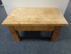 A rustic pine coffee table on chunky legs