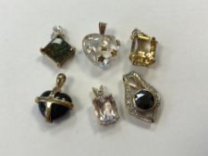 Six 9ct gold pendants, various.