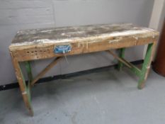 A twentieth century work bench fitted with a vice