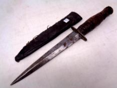A Fairbairn-Sykes style dagger in sheath
