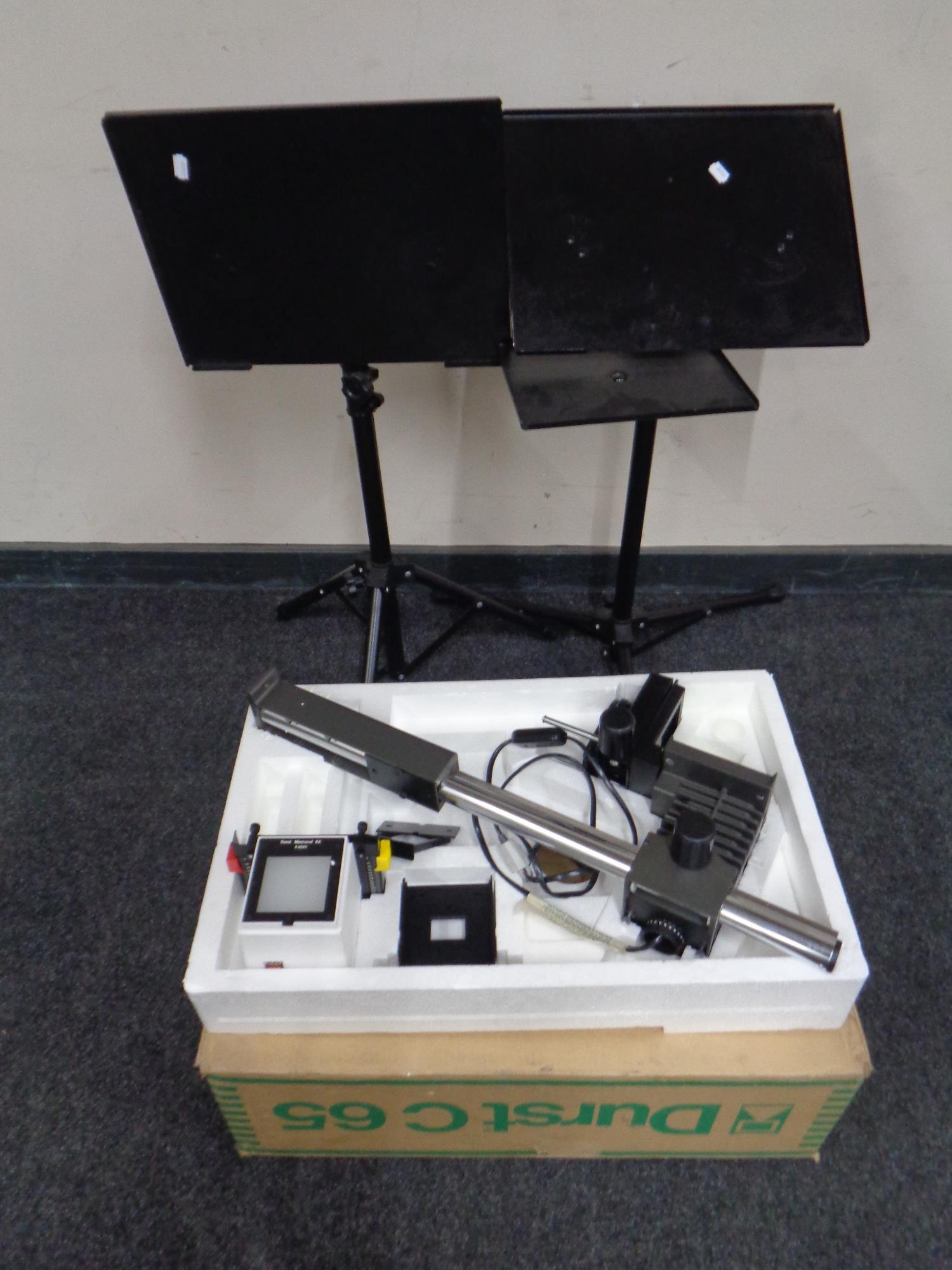 A boxed Durst Mesixcol photographic enlarger together with three metal tripod projector stands