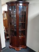 An Indonesian mahogany double door corner cabinet