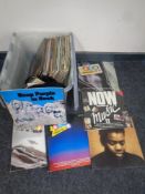 A box of vinyl LP's and 7 inch singles to include Now compilations, Tracy Chapman,