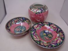 Three pieces of Maling pink peony pattern china no. 6027 including vase and two bowls.