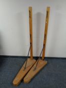 A pair of mid century wooden badminton net stands