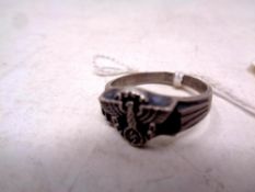 A silver ring bearing Nazi emblem