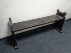 An antique pine bench (made from a church pew), length 132 cm.
