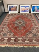 A machine made Eastern carpet 356 cm x 274 cm.